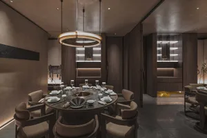 Industrial-themed restaurant interior with wooden furniture and concrete accents.