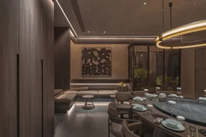 Modern restaurant interior with wooden materials and contemporary design features.