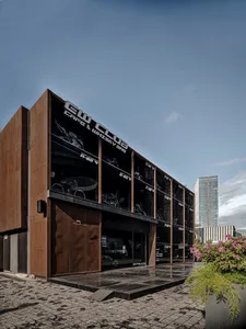 Industrial building with a metal exterior featuring a large window display.