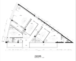Modern commercial space featuring clean lines, steel frames, glass partitions, and concrete flooring