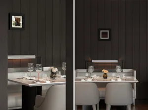 A modern restaurant interior with a white table setting on a wooden surface.