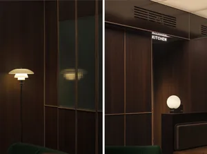 An interior design image showcasing a modern office with dark wooden walls and glass elements.
