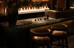 A modern bar with industrial design features made of stone.