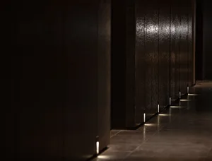 A minimalist hallway with a glass wall