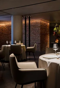 Modern restaurant interior with brick and concrete textures