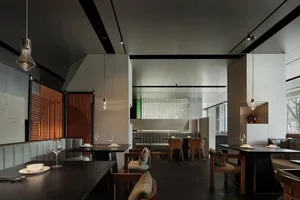 Modern restaurant interior with metal, glass, and wood elements