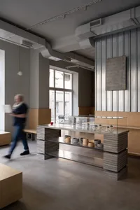 Modern cafe interior with concrete flooring and wooden furniture