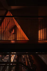 A modern cafe interior with a metal grid structure