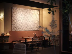 A cozy restaurant interior with wooden furniture and a warm, inviting atmosphere.