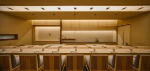 Modern restaurant interior with wooden furniture and minimalist design.