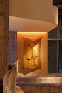 A minimalist installation featuring fabric art elements.
