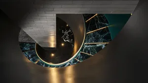 A modern interior featuring marble and stainless steel materials