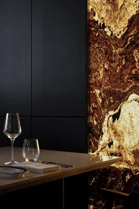 Modern restaurant interior with marble walls and minimalist design.
