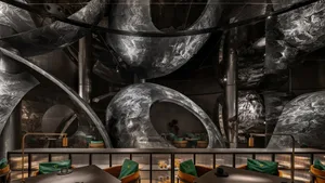 A modern bar with metallic, abstract design elements.