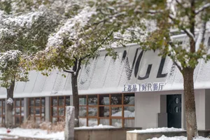 A modern restaurant exterior covered in snow.