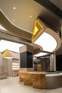 An interior design image of a modern coffee shop counter featuring marble and concrete elements.