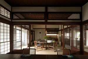 A wooden living room featuring paper and fabric elements.
