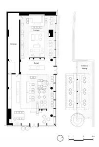 Floor plan detailing a commercial space with various functional zones and mixed material finishes.