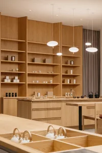 A modern kitchen with wooden shelves, cabinets, and countertops.