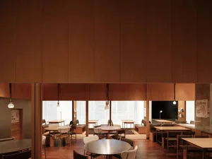 A modern, minimalist restaurant interior with wooden walls and tables, clean lines and open space.