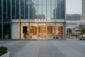 Modern storefront with glass facade and illuminated signage.