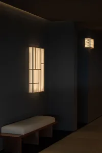 A minimalist lobby with a paper light fixture.