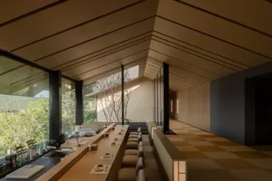 Modern restaurant bar with wooden walls and seating