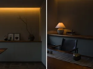 A cozy living room with warm lighting and wooden elements.