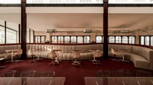 A spacious, industrial-style hospitality design with a mix of leather, metal, and glass materials.