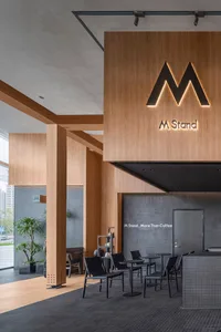 Modern coffee shop interior with wooden walls and concrete floor