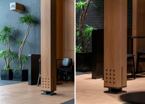 Modern lobby with wooden columns and potted plants