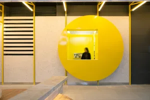A retail shop with a prominent yellow circle on the wall