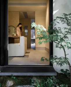 A minimalist residential interior space featuring wood materials.