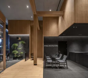 A modern coffee shop interior with wooden elements.