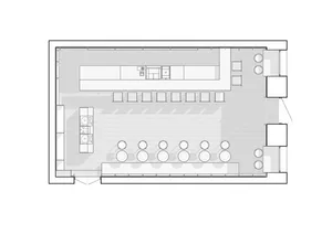 A floor plan of a coffee shop with seating areas, a counter, and a kitchen area.