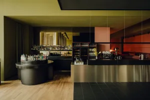 A modern bar with metal and wood accents