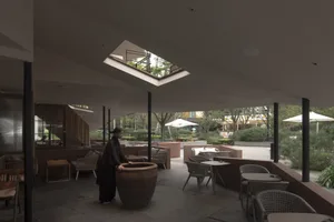 A modern minimalist cafe interior featuring wooden furniture and greenery.