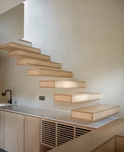 Floating wooden staircase in a modern kitchen