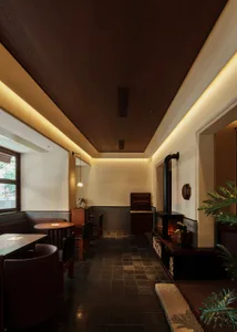 A modern restaurant interior featuring wood-paneled walls and tiled flooring.