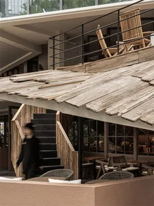 Industrial-style rooftop terrace featuring weathered wood materials.