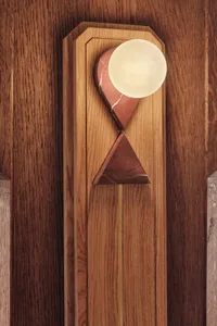 Modern lighting fixture with a combination of wood, marble, and brass materials.