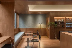 Contemporary design coffee shop with wooden interior and seating area