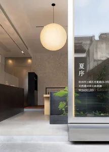Interior of a modern retail storefront featuring minimalist design elements with concrete finishes.