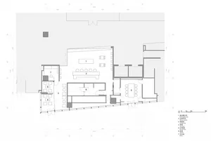 Floor plan of an office building showing offices, conference room, and interior design features.