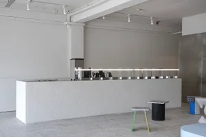 Concrete coffee shop counter with sleek design and minimalist aesthetics.