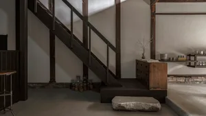 A modern minimalist interior space with wooden features.