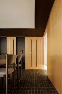 Modern residential space featuring wooden elements and minimalist design.