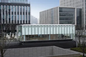 A modern building with glass and concrete exterior.