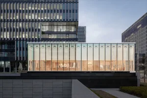 A modern building facade with large glass windows