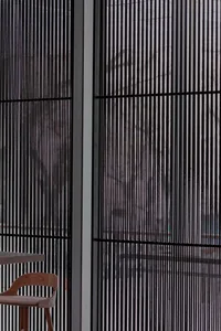 Modern interior design featuring metallic window blinds